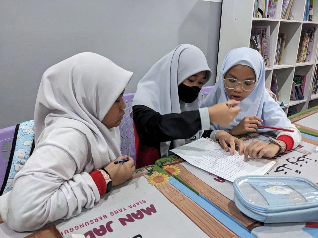 Students learning together in school